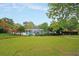 Large community pool area surrounded by lush green space and mature trees at 114 Marshside Dr, Summerville, SC 29485
