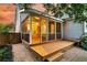 Inviting screened porch with wood flooring, ceiling fan and access to a charming brick patio at 114 Marshside Dr, Summerville, SC 29485
