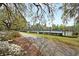 Neighborhood tennis courts are surrounded by trees and greenery with a walking path at 114 Marshside Dr, Summerville, SC 29485