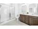 Bathroom featuring double sinks, tile floor, and a glass enclosed shower at 1150 Oak Bluff Ave, Charleston, SC 29492