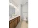 Bright bathroom boasts double sinks, white countertops, and a tile floor with a toilet at 1150 Oak Bluff Ave, Charleston, SC 29492