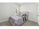 Cozy bedroom featuring a tufted headboard bed, a window with blinds, and soft carpeting at 1150 Oak Bluff Ave, Charleston, SC 29492