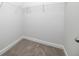 A walk-in closet is complete with white walls, wire shelving, and neutral carpeting at 1150 Oak Bluff Ave, Charleston, SC 29492