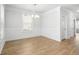 Bright dining room featuring wood floors and large windows that provide an open airy feel at 1150 Oak Bluff Ave, Charleston, SC 29492