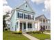Beautiful two-story home featuring a covered front porch and lovely landscaping at 1150 Oak Bluff Ave, Charleston, SC 29492