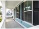 Cozy front porch with white columns and black shutters, perfect for relaxing at 1150 Oak Bluff Ave, Charleston, SC 29492