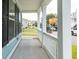 Spacious porch with white railings and columns, offering a view of the neighborhood at 1150 Oak Bluff Ave, Charleston, SC 29492