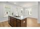 Stylish kitchen island with granite countertops, sink, and stainless steel dishwasher at 1150 Oak Bluff Ave, Charleston, SC 29492