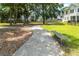 Walking path through the community with bench and landscaping at 1150 Oak Bluff Ave, Charleston, SC 29492