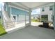 View from the screened porch to the garage and surrounding neighborhood at 1150 Oak Bluff Ave, Charleston, SC 29492