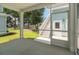Relaxing screened porch with access to backyard and exterior stairs at 1150 Oak Bluff Ave, Charleston, SC 29492