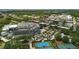 Expansive aerial view of a community featuring sports facilities, lush trees, and neighborhood at 116 Cartright St, Daniel Island, SC 29492