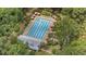 Stunning aerial view of a pristine community pool and surrounding lush landscape at 116 Cartright St, Daniel Island, SC 29492