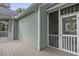 Back porch with an outdoor ceiling fan and lots of space at 116 Cartright St, Daniel Island, SC 29492