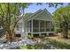 This home boasts a spacious screened porch and ample yard space for outdoor enjoyment at 116 Cartright St, Daniel Island, SC 29492