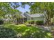 Lush green yard features a well-maintained lawn and manicured garden beds at 116 Cartright St, Daniel Island, SC 29492