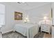 Cozy bedroom featuring light colored walls and a large framed print on the wall at 116 Cartright St, Daniel Island, SC 29492