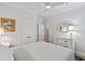 Bright bedroom featuring white decor, a ceiling fan, and closet space for storage, creating a calm retreat at 116 Cartright St, Daniel Island, SC 29492