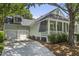 Charming single-story home featuring a well-manicured yard and an attached two-car garage at 116 Cartright St, Daniel Island, SC 29492