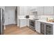 Well-appointed kitchen with stainless steel oven, marble countertops, and wine cooler at 116 Cartright St, Daniel Island, SC 29492