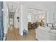 Open-concept living area with lots of natural light and hardwood floors throughout at 116 Cartright St, Daniel Island, SC 29492