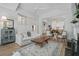 Comfortable living room featuring a fireplace, ceiling fan and wood floors at 116 Cartright St, Daniel Island, SC 29492