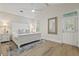 Bright main bedroom with white vaulted ceilings, fan, and decor at 116 Cartright St, Daniel Island, SC 29492