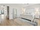 Bright main bedroom with walk-in closet, white vaulted ceilings, fan, and decor at 116 Cartright St, Daniel Island, SC 29492