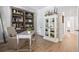 Bright and airy home office with custom bookcase and cabinet, providing ample storage solutions at 116 Cartright St, Daniel Island, SC 29492