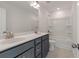 Modern bathroom featuring double sink vanity with grey cabinets and a tub/shower combo at 117 Palfrey Dr, Ridgeville, SC 29472