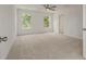 This bedroom has neutral carpet and natural light at 117 Palfrey Dr, Ridgeville, SC 29472
