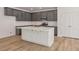 Stylish kitchen with gray cabinets, white countertops, and stainless steel appliances at 117 Palfrey Dr, Ridgeville, SC 29472