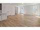 Spacious living room area with lots of natural light and wood-look floors at 117 Palfrey Dr, Ridgeville, SC 29472
