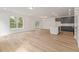 Spacious open-concept living area with wood floors and natural light at 117 Palfrey Dr, Ridgeville, SC 29472