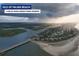 Aerial view of the beautiful Isle of Palms Beach with a bridge, homes, and water at 1183 Reserve Ln, Awendaw, SC 29429