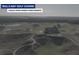 Aerial view of Bulls Bay Golf Course featuring manicured greens and a clubhouse at 1183 Reserve Ln, Awendaw, SC 29429