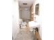 Compact bathroom featuring a toilet, sink, and storage with needed repairs at 1203 Hawthorne Rd, Hanahan, SC 29410