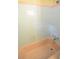 Classic bathtub with retro pink tile accents and vintage fixtures, creating a charming space at 1203 Hawthorne Rd, Hanahan, SC 29410