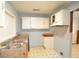 Classic kitchen featuring double basin sink, wood cabinetry and classic tile flooring at 1203 Hawthorne Rd, Hanahan, SC 29410