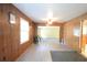 Spacious living room featuring paneled walls and wood laminate flooring at 1203 Hawthorne Rd, Hanahan, SC 29410