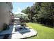 Backyard patio area with a picnic table and landscaped border, ideal for outdoor dining at 122 Avalon Rd, Summerville, SC 29483