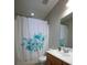 Bright bathroom featuring a shower with decorative curtain and wood vanity at 122 Avalon Rd, Summerville, SC 29483