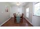 Inviting dining room is bathed in natural light and features hardwood floors, perfect for Gathering gatherings at 122 Avalon Rd, Summerville, SC 29483