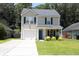 Charming two-story home with a one-car garage and a well-maintained lawn at 122 Avalon Rd, Summerville, SC 29483