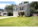 Charming two-story home boasting curb appeal with its manicured lawn at 122 Avalon Rd, Summerville, SC 29483