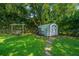 Backyard featuring a storage shed and a swing at 1369 Miles Dr, Charleston, SC 29407