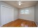 Inviting bedroom with beautiful wood floors, natural light, and a closet for storage at 1369 Miles Dr, Charleston, SC 29407