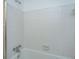 Classic bathtub and shower with all-white tiling and chrome fixtures at 1369 Miles Dr, Charleston, SC 29407