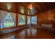 Sunroom with hardwood floors, wood paneling, and plenty of windows for natural light at 1369 Miles Dr, Charleston, SC 29407