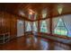 Sunroom with hardwood floors, brick accents, and plenty of natural light at 1369 Miles Dr, Charleston, SC 29407